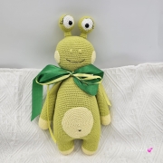 Zielony potworek na szydełku jaskrawy zielony potwór duże oczy rękodzieło na szydełku